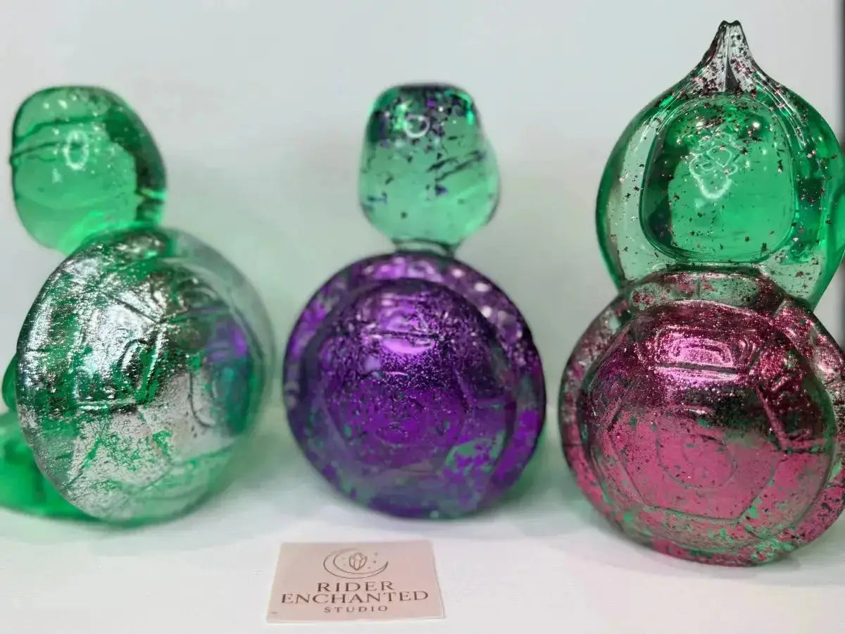 Handmade clear-green translucent epoxy resin zen turtle set with silver foil, purple glitter, and magenta glitter shells – Rider Enchanted Studio