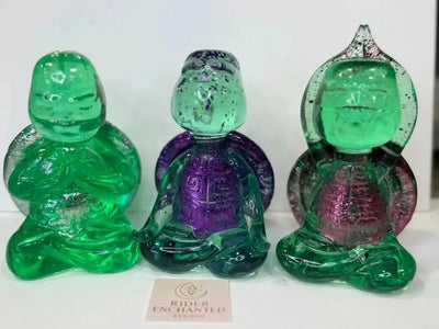 Set of three 5" clear-green epoxy resin zen turtles in seated poses with silver, purple, and pink shell accents – Rider Enchanted Studio